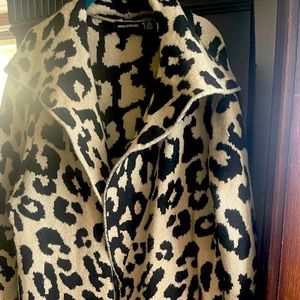 Cream and black long sweater with shock collar ,2 pockets, below the knee